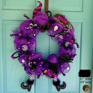 Cute Halloween wreath with witch legs and hat.